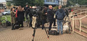 media and journalists waiting on scene for a press conference